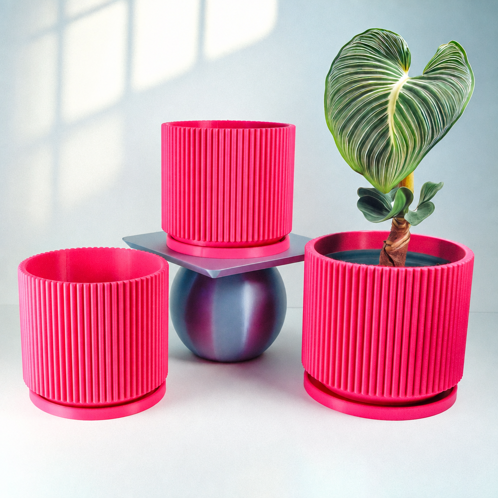 Three pink ribbed planters